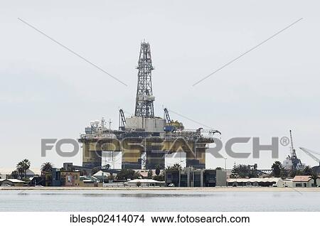 Oil rig in Angola, docked for repair at the port of Walvis Bay, Namib-Wuste, Walvis Bay City, Namibia, Africa View Large Photo Image Picture - Oil rig in Angola, docked for repair at the port of Walvis Bay, Namib-Wuste, Walvis Bay City, Namibia, Africa. Fotosearch