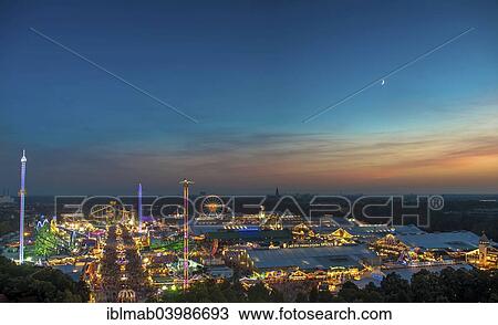 Stock Image - "Oktoberfest, evening mood, Theresienwiese, Munich, Upper Bavaria, Bavaria, Germany, Europe". Fotosearch