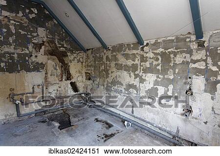 Old bathroom, removed tiles, rotted pipes, bathroom renovation View Large Photo Image Stock Image - Old bathroom, removed tiles, rotted pipes, bathroom renovation. Fotosearch