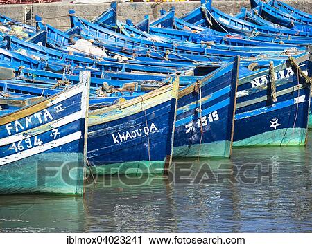 "Old blue fishing boats in the port of Essaouira, Unesco World Heritage Site, Morocco, Africa" View Large Photo Image Stock Image - "Old blue fishing boats in the port of Essaouira, Unesco World Heritage Site, Morocco, Africa". Fotosearch