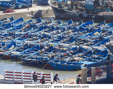 "Old blue fishing boats in the port of Essaouira, Unesco World Heritage Site, Morocco, Africa" View Large Photo Image Stock Photo - "Old blue fishing boats in the port of Essaouira, Unesco World Heritage Site, Morocco, Africa". Fotosearch