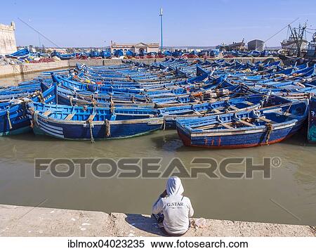 Stock Photography - "Old blue fishing boats in the port of Essaouira, Unesco World Heritage Site, Morocco, Africa". Fotosearch