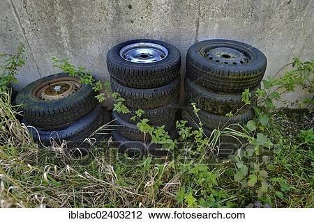 "Old car tires between nettles, Schaeftlarn, Bavaria, Germany, Europe" View Large Photo Image Stock Image - "Old car tires between nettles, Schaeftlarn, Bavaria, Germany, Europe". Fotosearch