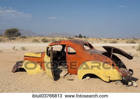 "Old car wreck stuck in the sand, Solitaire, Khomas Region, Namibia, Africa" View Large Photo Image Stock Image - "Old car wreck stuck in the sand, Solitaire, Khomas Region, Namibia, Africa". Fotosearch
