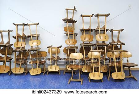 "Old chairs stacked in a school, Bavaria, Germany, Europe" View Large Photo Image Stock Photo - "Old chairs stacked in a school, Bavaria, Germany, Europe". Fotosearch