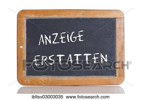 Stock Photography - "Old chalkboard, lettering """"ANZEIGE ERSTATTEN"""", German for """"COMPLAIN TO THE POLICE""""". Fotosearch