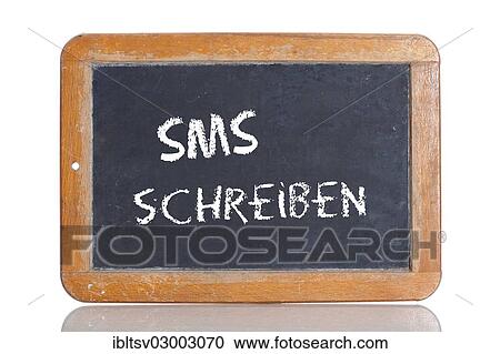 Stock Image - "Old chalkboard, lettering """"SMS SCHREIBEN"""", German for """"WRITE A TEXT MESSAGE""""". Fotosearch