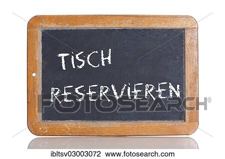 Stock Image - "Old chalkboard, lettering """"TISCH RESERVIEREN"""", German for """"BOOK A TABLE""""". Fotosearch