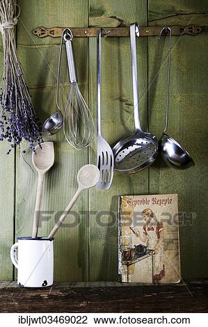 "Old cookbook with cooking utensils in front of a green wooden wall, Germany, Europe" View Large Photo Image Stock Image - "Old cookbook with cooking utensils in front of a green wooden wall, Germany, Europe". Fotosearch