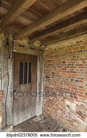 Stock Photography - "Old door and beams, entrance to the converted farmhouse at Bishop's Waltham Palace, Hampshire, England, United Kingdom, Europe". Fotosearch