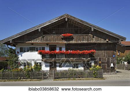 Stock Image - "Old farm, balcony with geraniums, Aying, Upper Bavaria, Bavaria, Germany, Europe". Fotosearch