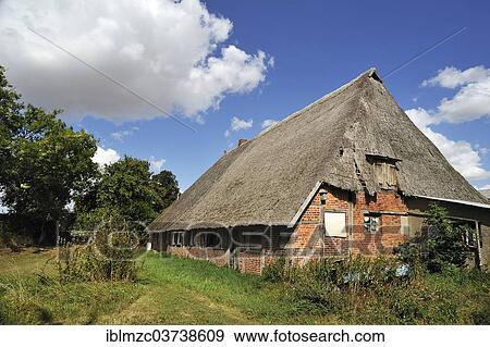 "Old farmhouse with low thatched roof, Gross Runz, Mecklenburg-Western Pomerania, Germany, Europe" View Large Photo Image Stock Photo - "Old farmhouse with low thatched roof, Gross Runz, Mecklenburg-Western Pomerania, Germany, Europe". Fotosearch