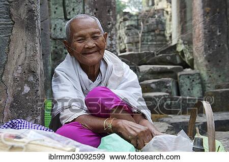 "Old female Shaman at the temple complex of Preah Khan or Prah Khan, Preah Khan, Siem Reap, Siem Reap Province, Cambodia, Asia" View Large Photo Image Stock Photo - "Old female Shaman at the temple complex of Preah Khan or Prah Khan, Preah Khan, Siem Reap, Siem Reap Province, Cambodia, Asia". Fotosearch