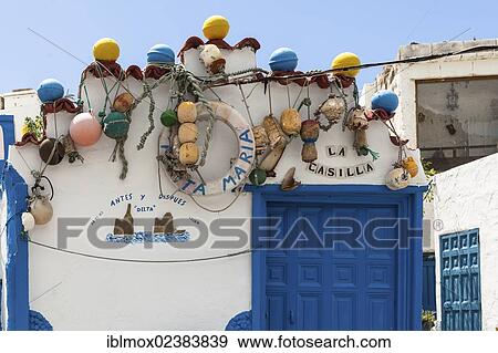 "Old fenders as decoration on a house in the fishing village of Puerto De Las Nieves, El Palmeral, Agaete, Gran Canaria, Canary Islands, Spain, Europe, PublicGround, Europe" View Large Photo Image Stock Photo - "Old fenders as decoration on a house in the fishing village of Puerto De Las Nieves, El Palmeral, Agaete, Gran Canaria, Canary Islands, Spain, Europe, PublicGround, Europe". Fotosearch