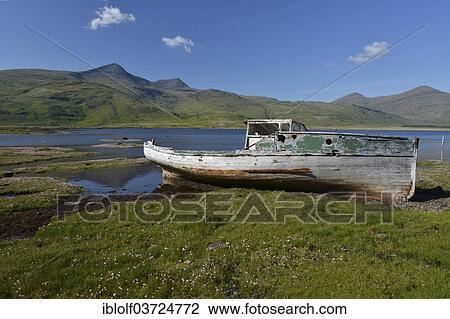 "Old fishing boat, boat wreck in the bay, Munro Mountain, Argyll, Isle of Mull, Scotland, United Kingdom, Europe" View Large Photo Image Stock Image - "Old fishing boat, boat wreck in the bay, Munro Mountain, Argyll, Isle of Mull, Scotland, United Kingdom, Europe". Fotosearch