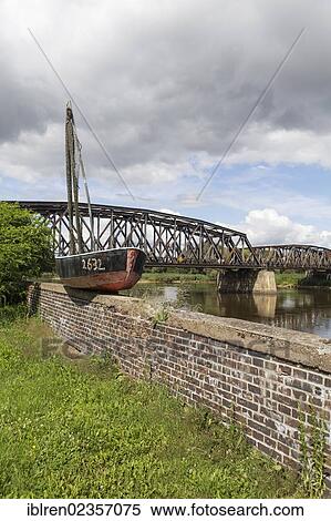 "Old fishing boat on the border river Oder, Polish-German border, Kuestrin to Kostrzyn, Brandenburg, Germany, Europe" View Large Photo Image Stock Photography - "Old fishing boat on the border river Oder, Polish-German border, Kuestrin to Kostrzyn, Brandenburg, Germany, Europe". Fotosearch