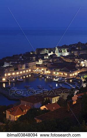 Picture - "Old Harbour and the historic centre at dusk, Dubrovnik, Dalmatia, Croatia, Europe". Fotosearch