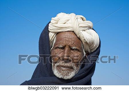 Stock Image - "Old Indian man with a white turban, portrait, Pushkar, Rajasthan, India, Asia". Fotosearch