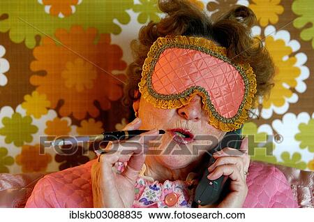 "Old lady with sleep blindfold and cigarette with a holder, colourful retro-look" View Large Photo Image Stock Photography - "Old lady with sleep blindfold and cigarette with a holder, colourful retro-look". Fotosearch