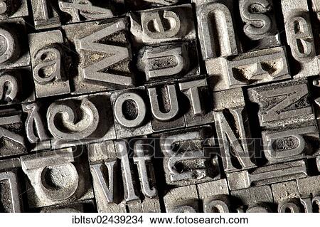 Picture - Old lead letters forming the word OUT. Fotosearch