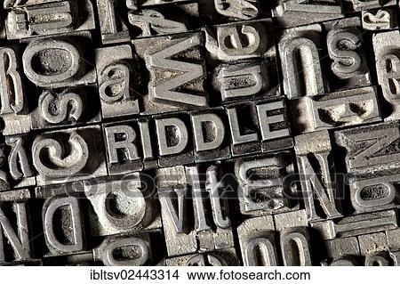 Picture - Old lead letters forming the word RIDDLE. Fotosearch