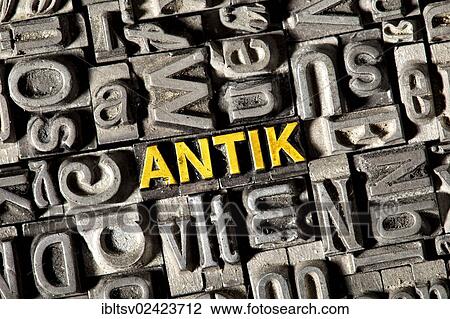 Stock Image - Old lead letters forming the word Antik, German for antique. Fotosearch