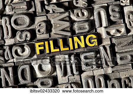 Stock Image - Old lead letters forming the word Filling. Fotosearch