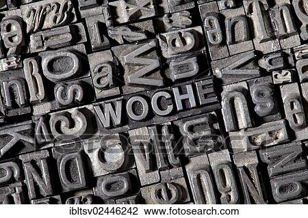 Stock Image - "Old lead letters forming the word WOCHE, German for week". Fotosearch
