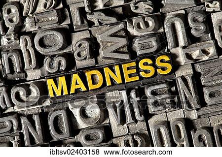 "Old lead letters forming the word """"MADNESS""""" View Large Photo Image Stock Photo - "Old lead letters forming the word """"MADNESS""""". Fotosearch