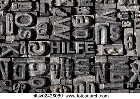Stock Photo - "Old lead letters forming the word HILFE, German for help". Fotosearch