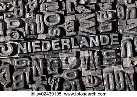 Stock Photography - "Old lead letters forming the word NIEDERLANDE, German for Netherlands". Fotosearch
