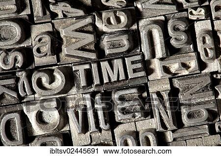 Stock Image - Old lead letters forming the word TIME. Fotosearch