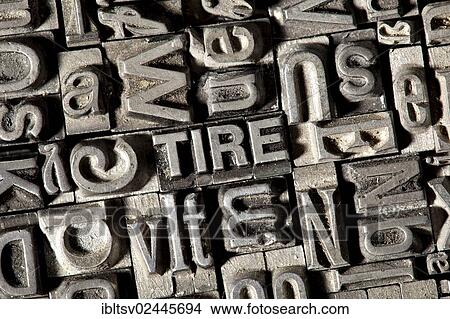 Old lead letters forming the word TIRE View Large Photo Image Picture - Old lead letters forming the word TIRE. Fotosearch