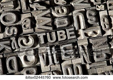 Stock Image - Old lead letters forming the word TUBE. Fotosearch