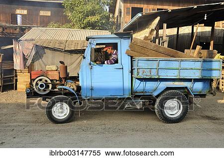 Stock Photography - "Old lorry with open engine, Nyaung Shwe, Inle-See, Shan State, Myanmar, Burma, Asia". Fotosearch