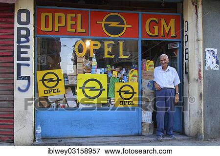 "Old man is standing at a shop entrance, shop selling spare parts for Opel or Vauxhall cars, General Motors, Beirut, Lebanon, Asia" View Large Photo Image Stock Photo - "Old man is standing at a shop entrance, shop selling spare parts for Opel or Vauxhall cars, General Motors, Beirut, Lebanon, Asia". Fotosearch