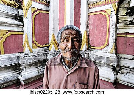 "Old man standing in front of the walls of a monastery, Burma, Myanmar, Southeast Asia, Asia" View Large Photo Image Stock Photo - "Old man standing in front of the walls of a monastery, Burma, Myanmar, Southeast Asia, Asia". Fotosearch