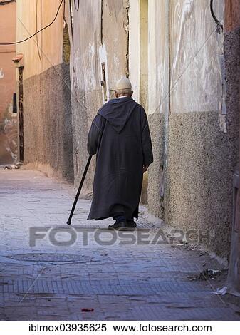 "Old man walking down an alleyway in the Medina, Marrakech, Marrakech-Tensift-Al Haouz, Morocco, Africa" View Large Photo Image Stock Photography - "Old man walking down an alleyway in the Medina, Marrakech, Marrakech-Tensift-Al Haouz, Morocco, Africa". Fotosearch