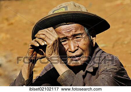 "Old man wearing a hat in northeastern Cambodia, Southeast Asia, Asia" View Large Photo Image Stock Photo - "Old man wearing a hat in northeastern Cambodia, Southeast Asia, Asia". Fotosearch