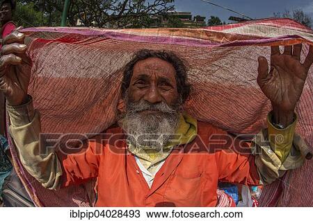Stock Image - "Old man with a cloth, Guwahati, Assam, India, Asia". Fotosearch