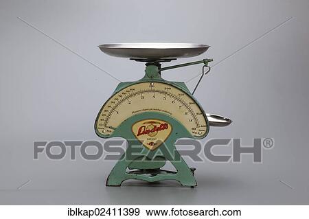 Stock Photo - "Old mechanical, iron 10kg kitchen scale, 1930s". Fotosearch