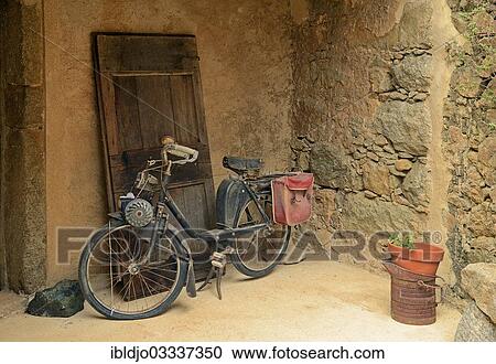 "Old moped in front of a wall, Pigna, Corsica, France, Europe" View Large Photo Image Stock Image - "Old moped in front of a wall, Pigna, Corsica, France, Europe". Fotosearch