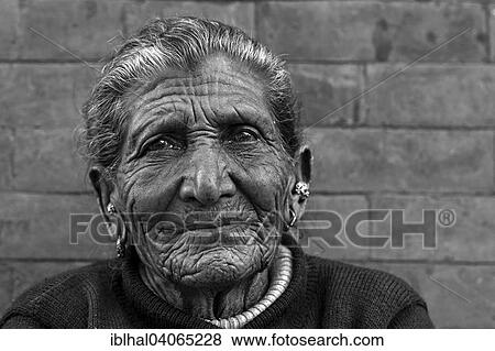 "Old Nepalese woman, furrows in her face, ear jewellery, portrait, near Panauti, Nepal, Asia" View Large Photo Image Stock Photo - "Old Nepalese woman, furrows in her face, ear jewellery, portrait, near Panauti, Nepal, Asia". Fotosearch