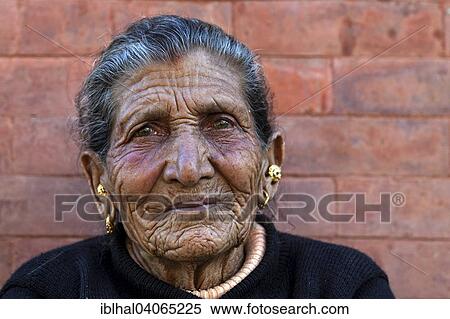 "Old Nepalese woman, furrows in her face, ear jewellery, portrait, near Panauti, Nepal, Asia" View Large Photo Image Stock Photography - "Old Nepalese woman, furrows in her face, ear jewellery, portrait, near Panauti, Nepal, Asia". Fotosearch