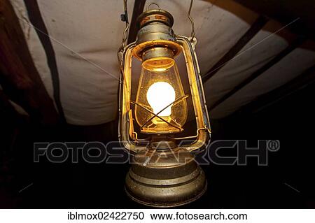Stock Image - Old oil lamp, electric, Masai Mara National Park in Kenya, East Africa, Africa. Fotosearch