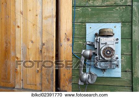 "Old phone on the building entrance to the Port Authority in the Russian mining settlement of Barentsburg, Isfjorden, Spitsbergen, Svalbard, Norway, Europe" View Large Photo Image Stock Image - "Old phone on the building entrance to the Port Authority in the Russian mining settlement of Barentsburg, Isfjorden, Spitsbergen, Svalbard, Norway, Europe". Fotosearch