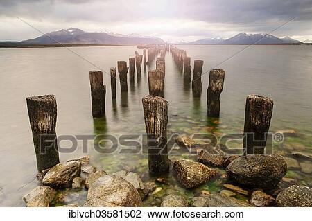 "Old pillars of a jetty, Isla Diego Portales at back, Puerto Natales, Ultima Esperanza province, Chile, South America" View Large Photo Image Stock Image - "Old pillars of a jetty, Isla Diego Portales at back, Puerto Natales, Ultima Esperanza province, Chile, South America". Fotosearch