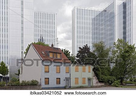 "Old residential houses about to be demolished, office towers in the back, Bilk, Dusseldorf, North Rhine-Westphalia, Germany, Europe" View Large Photo Image Stock Image - "Old residential houses about to be demolished, office towers in the back, Bilk, Dusseldorf, North Rhine-Westphalia, Germany, Europe". Fotosearch