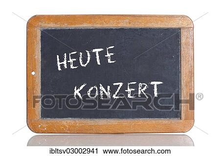 Stock Image - "Old school blackboard with the term HEUTE KONZERT, German for concert today". Fotosearch
