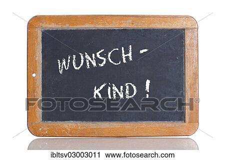 Stock Image - "Old school blackboard with the term WUNSCHKIND, German for planned child". Fotosearch